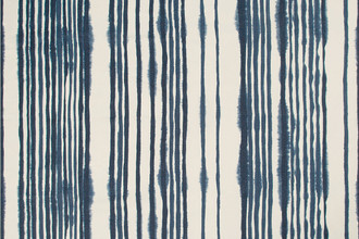 Tracks Printed Fabric in Dark Indigo showcases bold hand-drawn lines in deep navy blue, offering a graphic, artisanal feel with striking contrast.