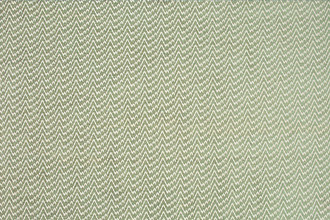 Zenith Woven Fabric in Sage — a soft, muted green with geometric design elements that introduce a natural, calming energy, bringing refined elegance and subtle texture to spaces.