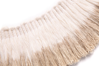 Natural linen fringe trim with neutral dip dye, blending into the pure, uncoloured texture of the handcrafted top of the trim.