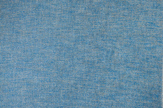 Denali Plain Woven Fabric in Denim, offering a cool, deep blue with a textured finish, perfect for creating a contemporary, grounded look in any space.