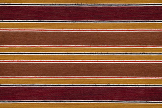 A striped woven fabric in rich red, terracotta tones with small stripes of orange and navy.