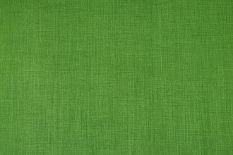 Soprano plain coloured printed linen fabric in bright green colour. Ideal for upholstery, curtains, and home decor accessories.