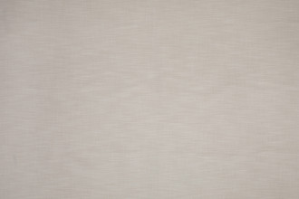 Maroma Perennials® Performance Fabric in Latte, a creamy neutral tone that complements patterned textiles with quiet sophistication.