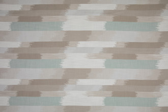 SOMBRE Perennials Performance Ikat Woven Fabric in a natural and pale blue colour. Designed for outdoor upholstery and furniture.