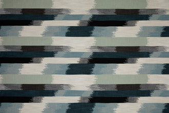SOMBRE Perennials Performance Ikat Woven Fabric in a blue, green, white and black colours. Designed for outdoor upholstery and furniture.