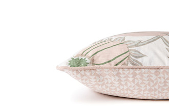 Side view of Carnival Cushion in Olive – highlighting the soft pink and green pomegranate front and geometric back, finished with coordinating piping, 50x50cm.