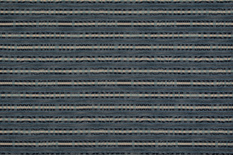 Hotline fabric in indigo and pale blue tones. Has a horizontal stripe of geometric designs