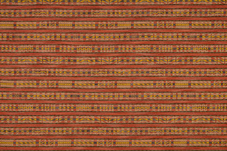 Hotline fabric in rich reds and yellow tones. Has a horizontal stripe of geometric designs
