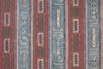 A vibrant wallpaper with vertical stripes and geometric patterns featuring diamonds, florals, and intricate borders in red, blue, white, and yellow. A vibrant wallpaper with vertical stripes and geometric patterns featuring diamonds, florals, and intricate borders in red, blue, white, and yellow.