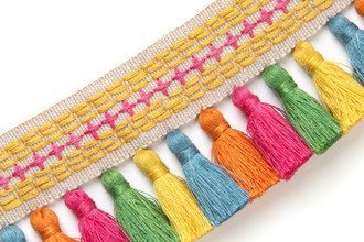 Jamboree Tasselled Tape in Hot Pink — a decorative trim featuring lively hot pink tassels, adding playful movement and handcrafted charm to upholstery and soft furnishing details.
