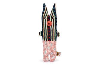 Front: "Elli squirrel creature No. 05 by Donna Wilson, featuring a stitched patchwork body from upcycled fabrics in playful tones, with expressive face and stitched tail."