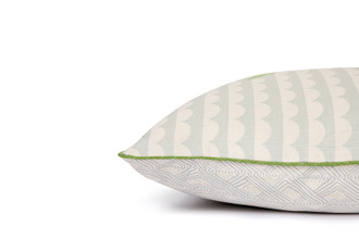 Side View of We Sailed Away Cushion in Pale Blue showing front and back pattern with contrasting green vertelli piping trim.