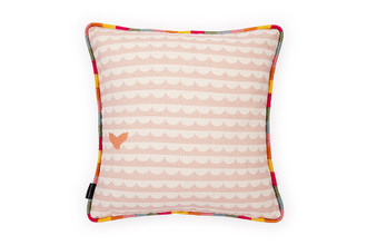 Back view: Peach cushion with bold waves and whale's tails design with Gala hot Pink Striped Piping.