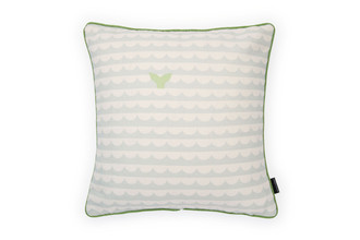 Front view: Pale Blue cushion with bold waves and whale's tails design with green piping