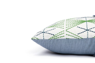Side view of Mikado Green Cushion showing the contrast of the Mikado fabric against the blue linen back.