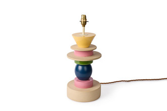 Totum ceramic lamp base featuring multi-coloured glazed blue, pink, and yellow, and natural clay stacked components in triangle and circle shapes. Gold E27 bulb holder and twisted gold wire complete the elegant design.