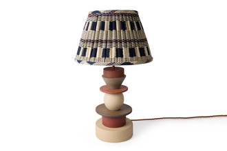Totum ceramic lamp base featuring multi-coloured glazed blue, pink, and yellow, and natural clay stacked components in triangle and circle shapes. Gold E27 bulb holder and twisted gold wire complete the elegant design.