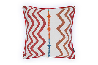 Front view of Rick Rack cushion in terracotta, showcasing Kit Kemp’s embroidered arrow design on linen with flowing, tactile detail and bold terracotta tones.
