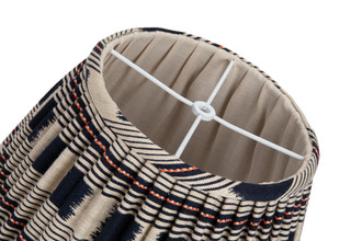 Top view of the 14” Lost and Found Indigo Lampshade with pleated indigo, orange and natural woven fabric, natural linen lining. Handcrafted in London using Kit Kemp’s vibrant Lost and Found Weave. A US Top Finial Fitting.
