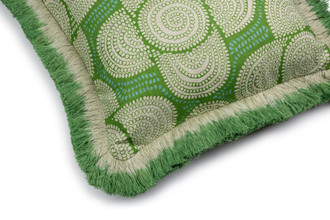 Side detail of Azteque cushion in green with ombré green linen fringe trim, featuring a fun abstract floral dotted pattern printed on a linen base cloth.