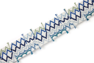 Outdoor and performance woven border trim blue with playful detailing, designed for durable furnishings and upholstery applications.