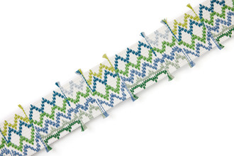 Outdoor and performance woven border trim green with playful detailing, designed for durable furnishings and upholstery applications.