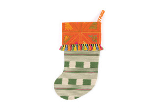 Lost and Found green stocking with Orange wool and multi-coloured tassel trim on the hood, made from Christopher Farr Cloth remnants — a one-of-a-kind heirloom gift.