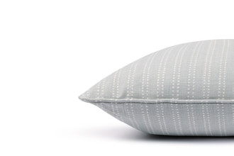 Algonquin linen cushion in pale blue stripe with piping, designed for sophisticated and refined interior settings.