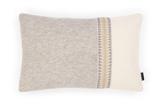 Alpaca Smoke Grey and Ecru rectangular bolster cushion with split-colour design, finished with a Railroad Natural trim strip for subtle decorative edging.