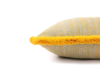 Side detail, Lomi Chichi cushion 45x45cm in kiwi with multicolour Chichi fringe trim, vibrant outdoor cushion