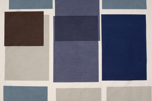 Large scale printed overlapping blocks in shades of blues and naturals.