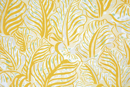 Mille Feuilles printed fabric in Lemon, featuring expressive leaf forms in bright yellow and neutral tones for a fresh, artful interior statement.