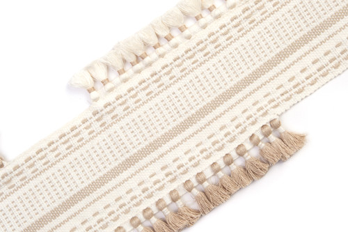Pom Parade Border Trim in natural — light linen-toned stitched border with tasselled trims in ecru and natural.
