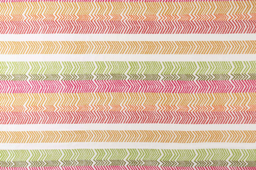 Rosa colourway Kit Kemp Bookend Perennials® Performance Woven Fabric featuring a vibrant multi-coloured striped arrow design in yellow, orange, pink, and green.