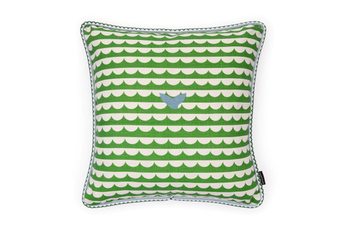 Front view: Green cushion with bold waves and whale's tails design.