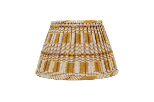 Front view of the 14” Lost and Found Lemon Lampshade with pleated yellow and natural woven fabric, natural linen lining. Handcrafted in London using Kit Kemp’s vibrant Lost and Found Weave.