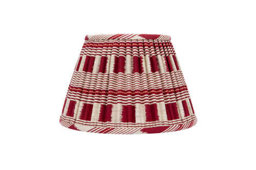 Front view of the 14” Lost and Found Ruby Lampshade with pleated red and natural woven fabric, natural linen lining. Handcrafted in London using Kit Kemp’s vibrant Lost and Found Weave.