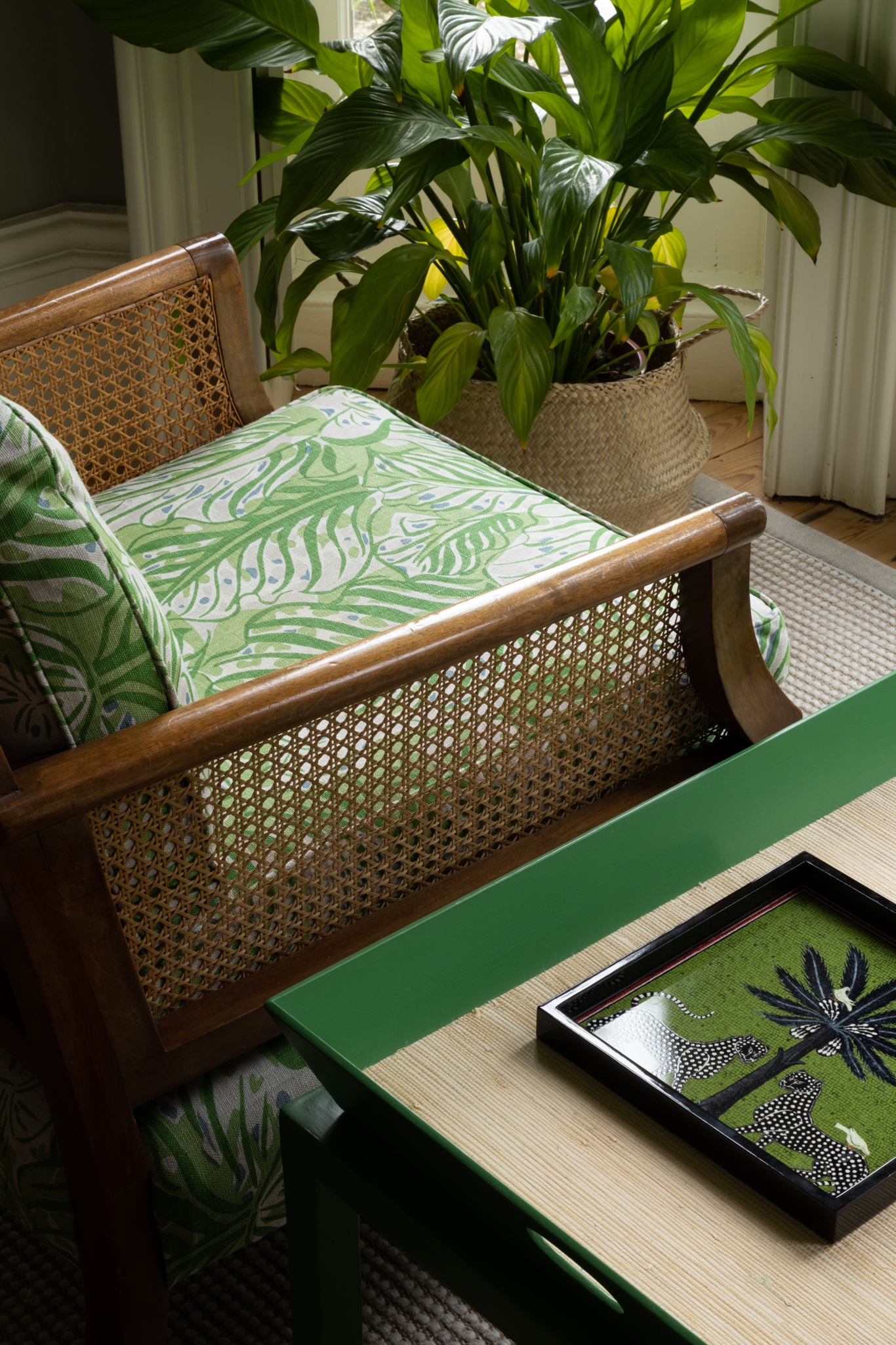 Armchair upholstered in Mille Feuilles indoor-outdoor printed fabric in Green by Raoul Dufy. Interior design by Atelier, showcasing the botanical pattern in a fresh, versatile setting.