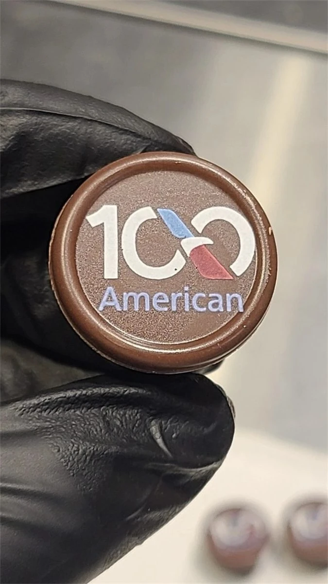 Chocolate disc printed with a 100-year American anniversary logo
