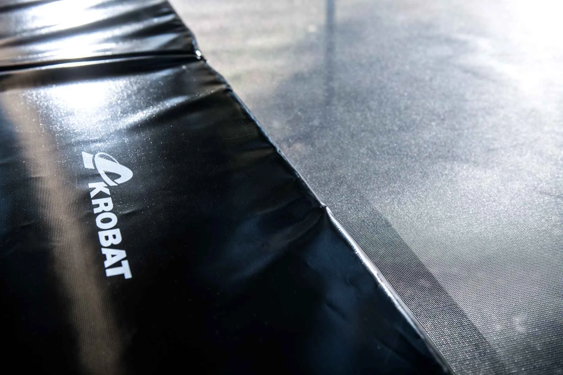 Close-up of the branded safety pad on the Akrobat Primus Challenger PLUS frame