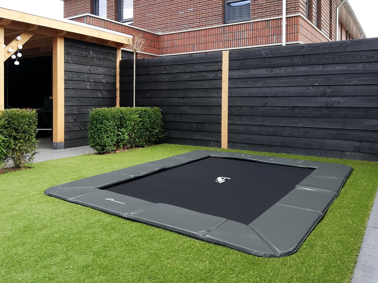 Akrobat Orbit Flat rectangular flush-to-ground trampoline with anthracite safety pad, second customer installation