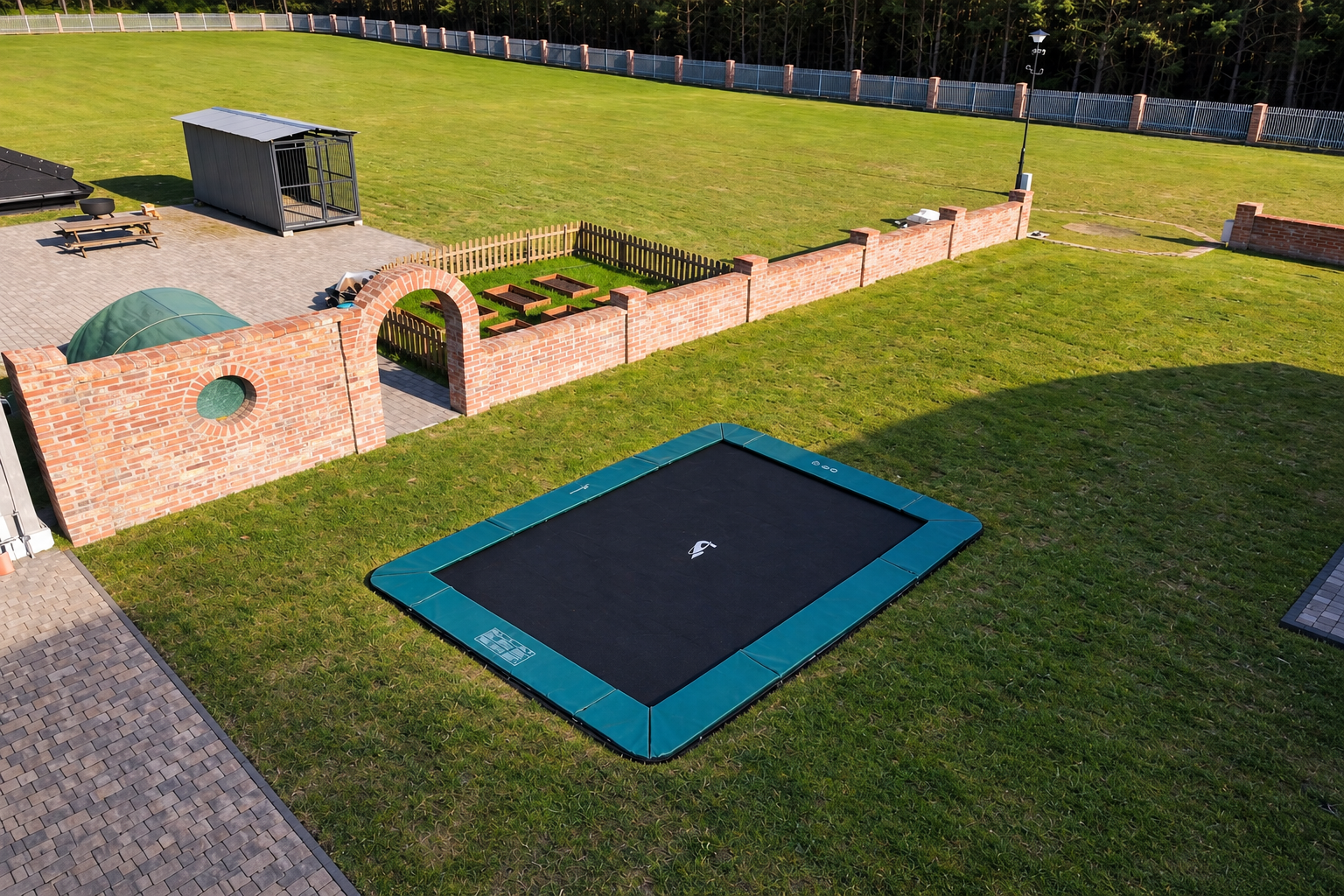 Customer photo of an Akrobat Primus Flat rectangular trampoline installed in a garden