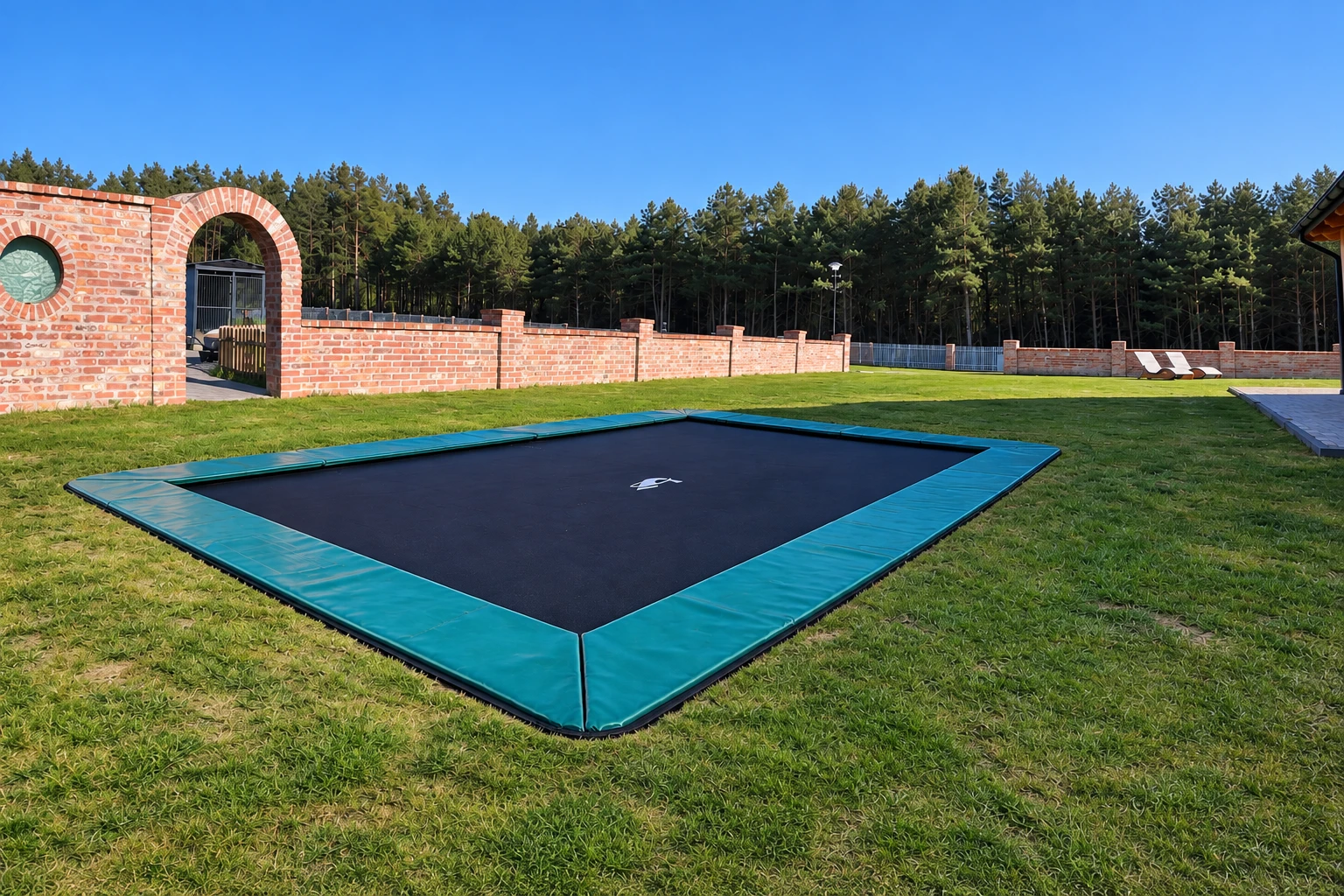 Customer photo of an Akrobat Primus Flat rectangular trampoline installed in a garden