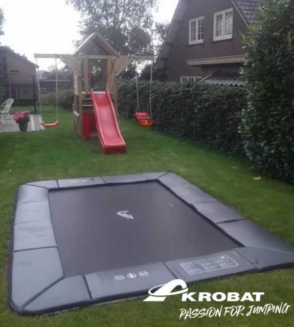 Akrobat Primus Flat 11x8ft rectangular trampoline set into the ground