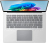 Full overhead perspective of the premium platinum backlit keyboard layout and wide precision haptic touchpad.