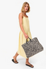 Clare V Summer Simple Tote Black/Cream Raffia full body, held at side