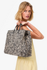 Clare V Summer Simple Tote Black/Cream Raffia held behind shoulder