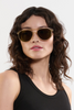 Krewe Brando Champagne Iberia Polarized on heart face shape, female model