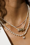 Adina Reyter 18" Chunky Seed Pearl Necklace on model, stacked with other necklaces