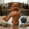 Wood Baba Yaga statue at our pagan store facing left